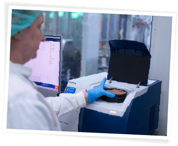 QA lab technician using a FOSS machine to test the typical analysis of Big Dog Pet Foods products