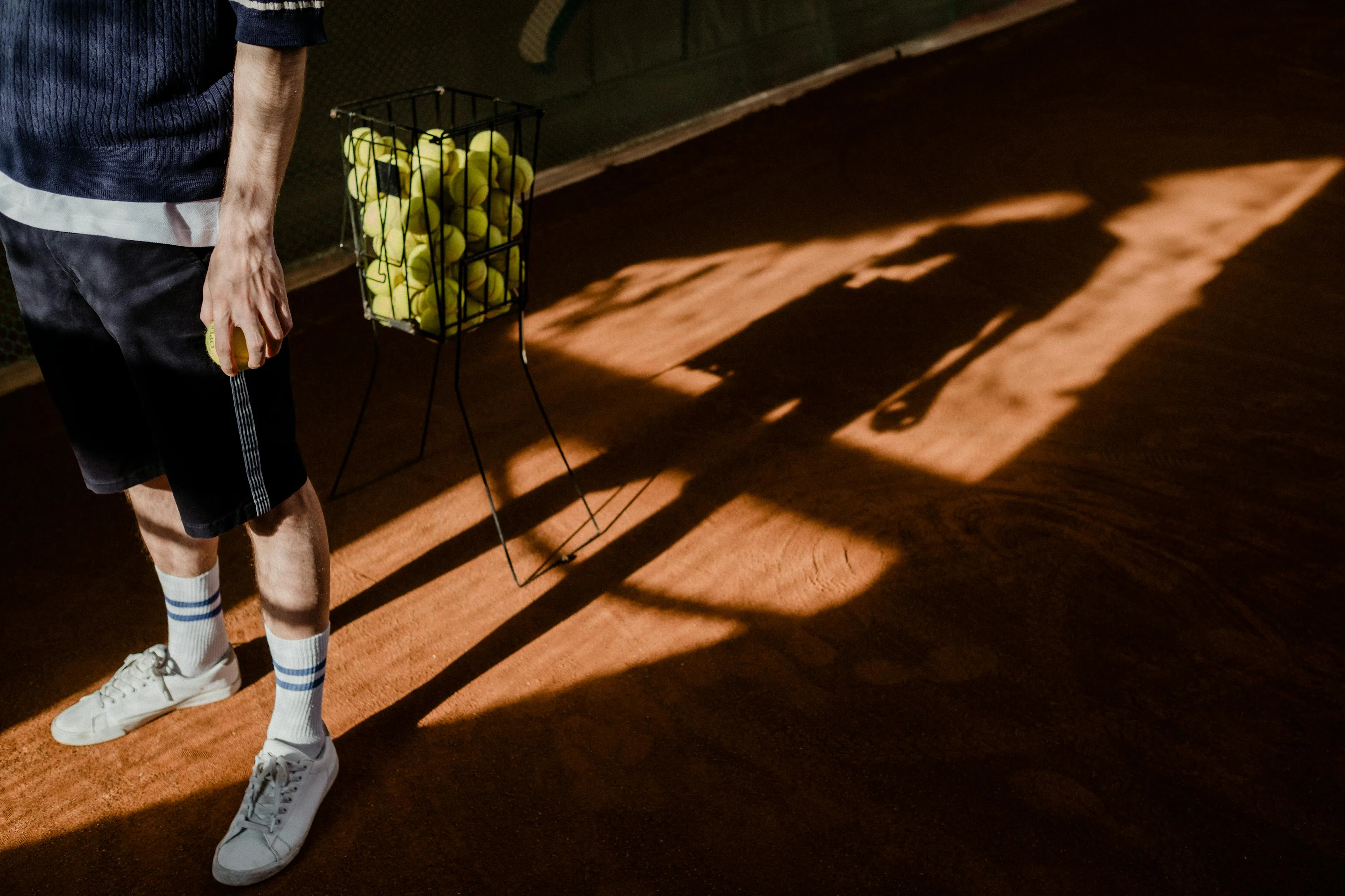 Man with Pack of Padel Ball