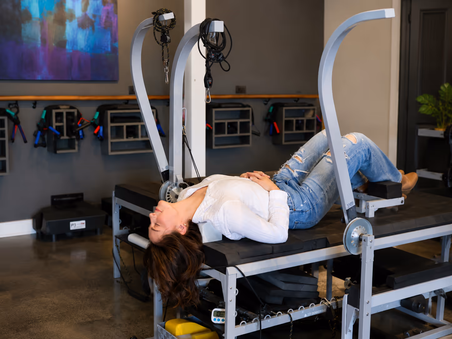 Patient relaxing during a cervical traction therapy session designed to reduce neck tension and improve spinal function.