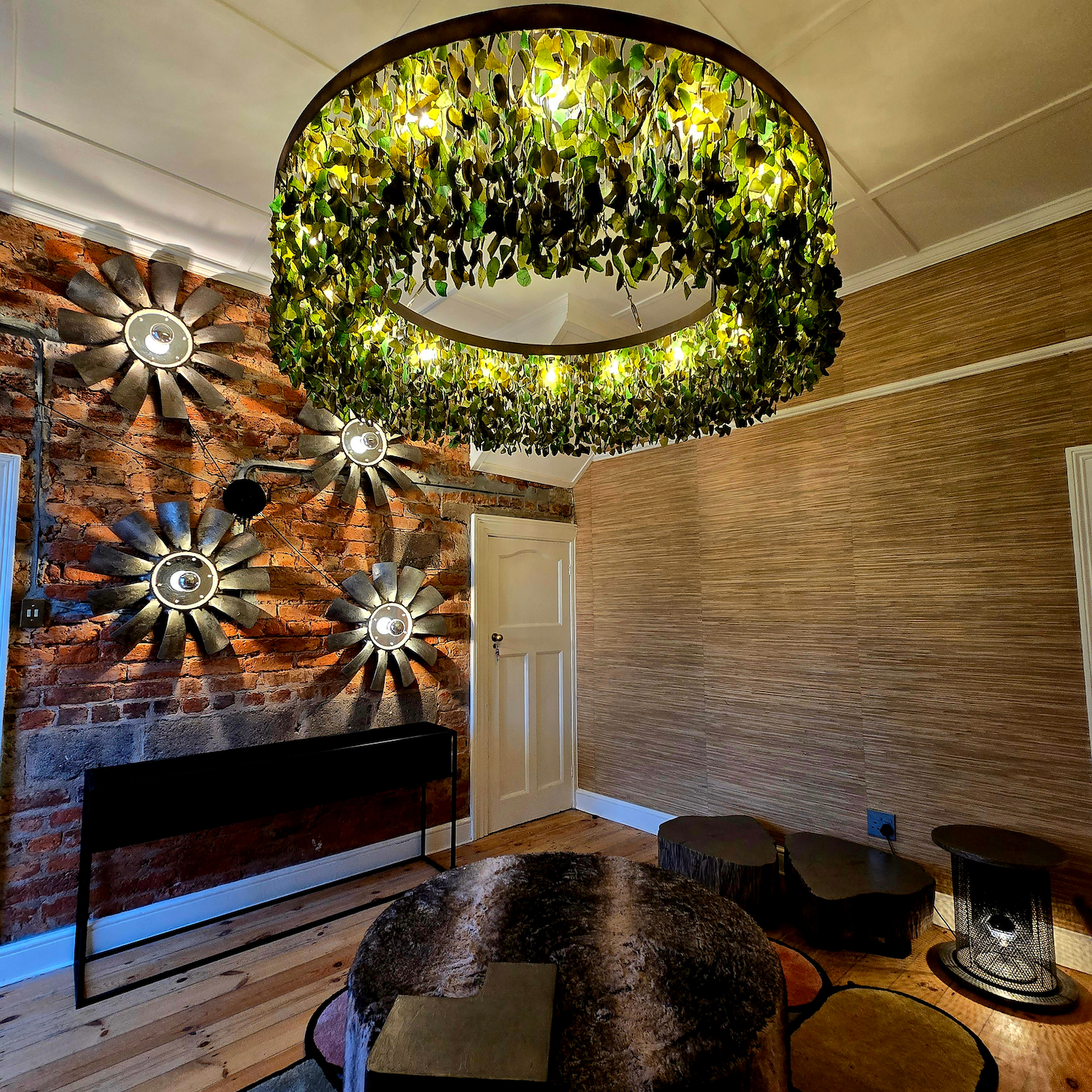 Bespoke charcoal sea glass tiered chandelier designed for a double-volume space