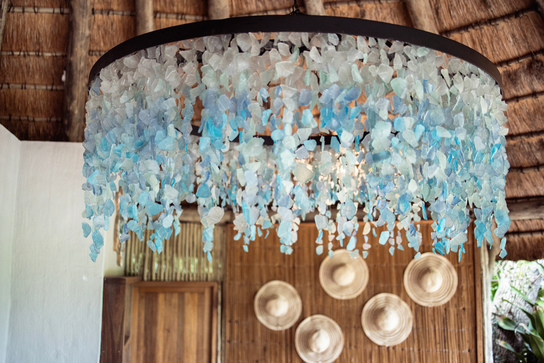 Multiple circle chandeliers installed in a interior designed space