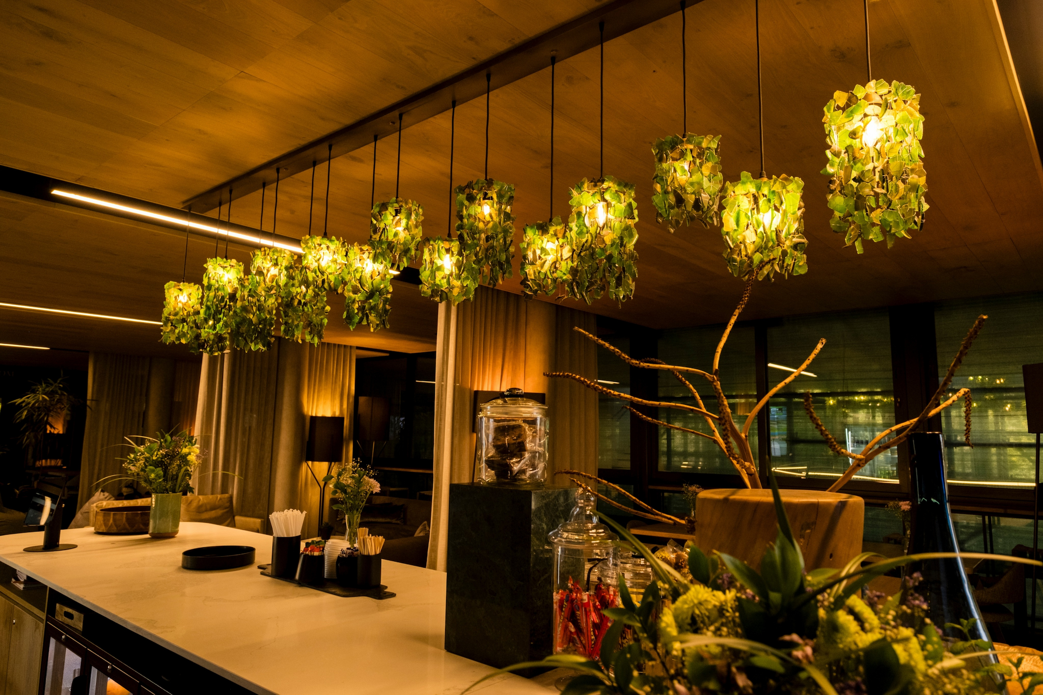 A charcoal linear light feature over a dining room table