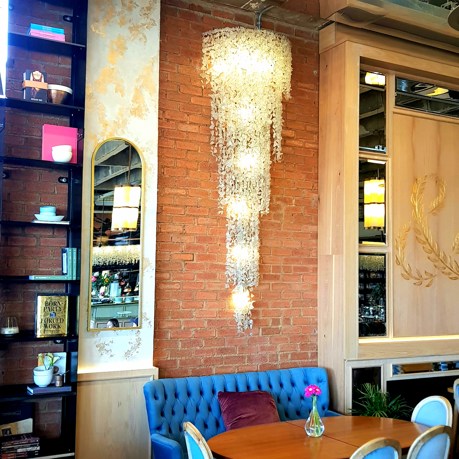A charcoal linear light feature over a dining room table