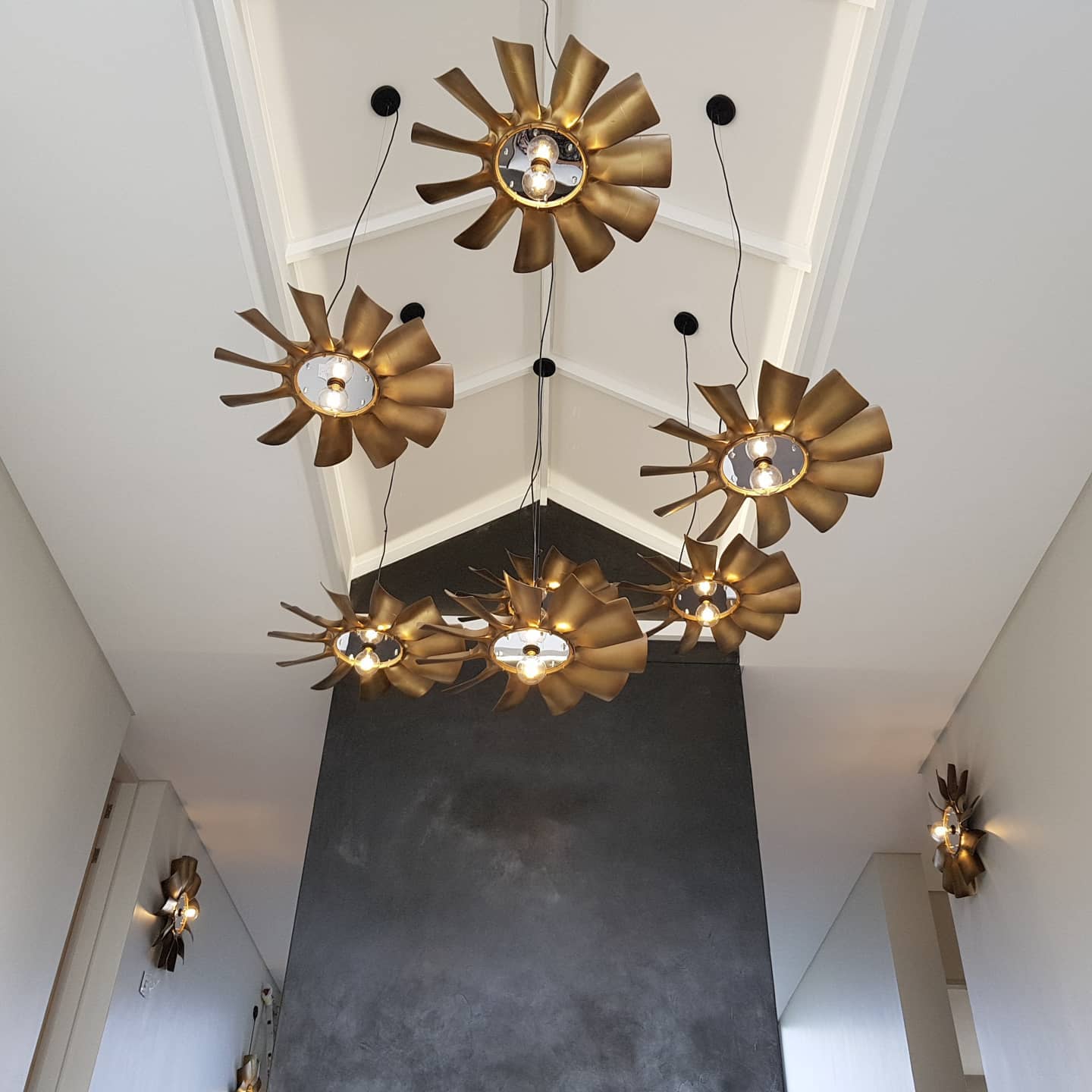 Double Volume Industrial Blow Light Pendants installed in a double volume space in Steyn City