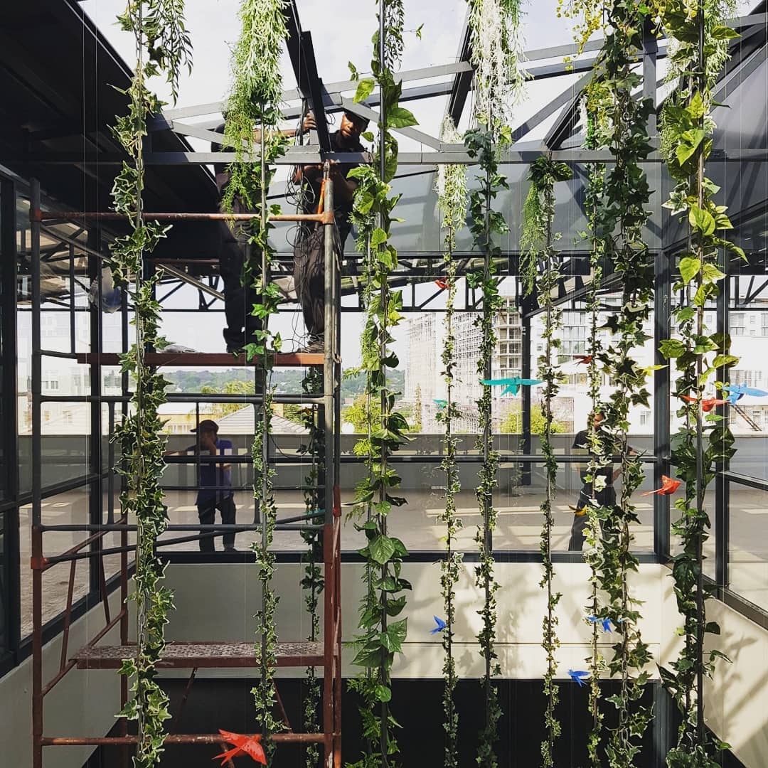 A energy efficient installation of leaves, birds, lights and metals