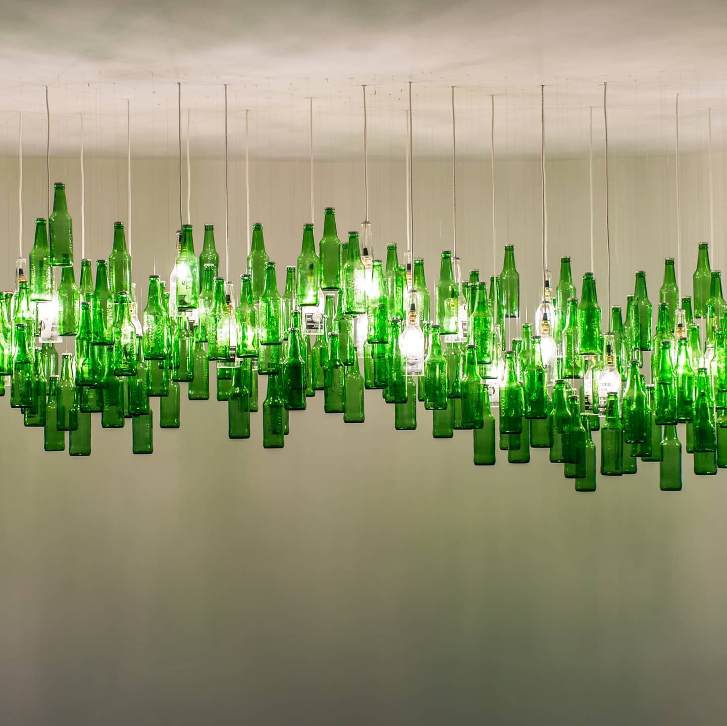 Green Bottles hung in an atrium at AB InBev in Johannesburg 