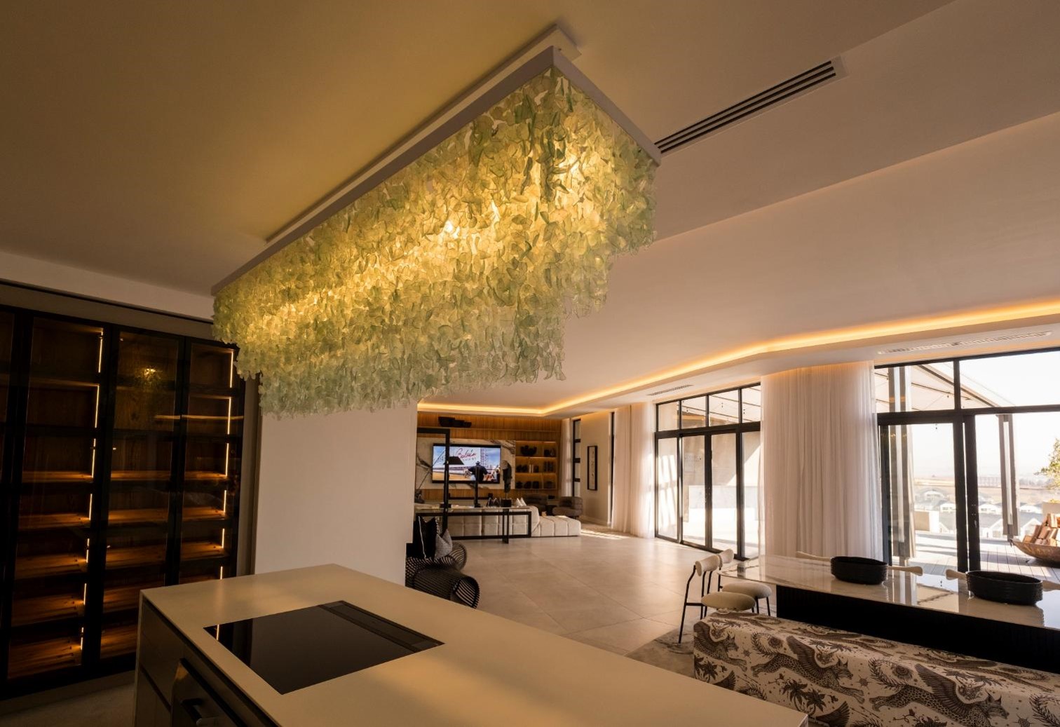 A charcoal linear light feature over a dining room table