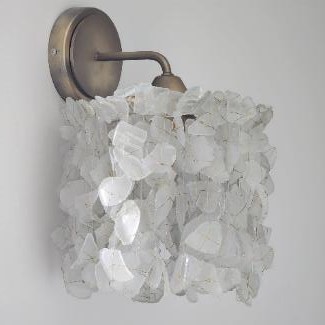 A wall sconce made from recycled glass.  