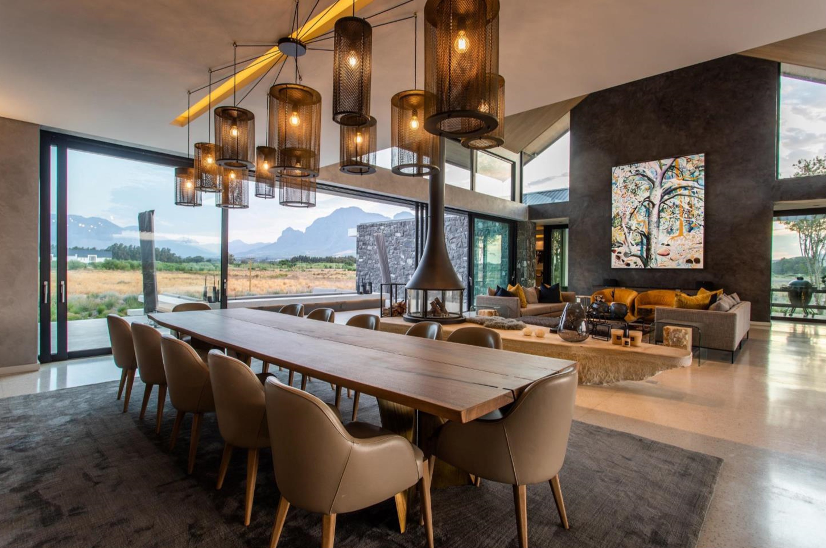 A Light Sculpture installation of Copper Truck Lights over a dining Room. 