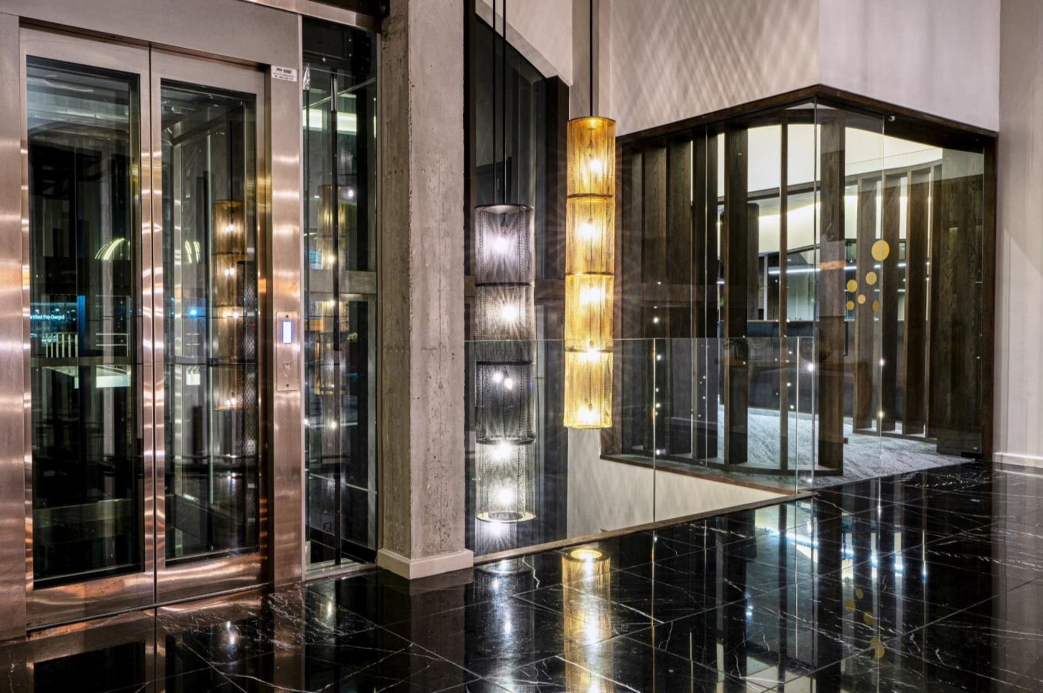 Totum very long light pendants in a double volume space.  Volvo head office