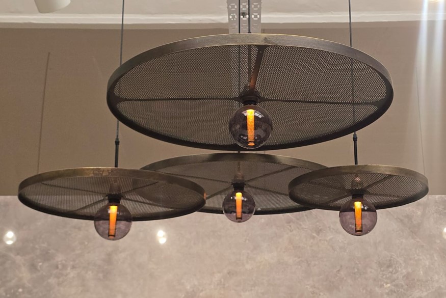 4 Fluxx black light fittings over a kitchen island