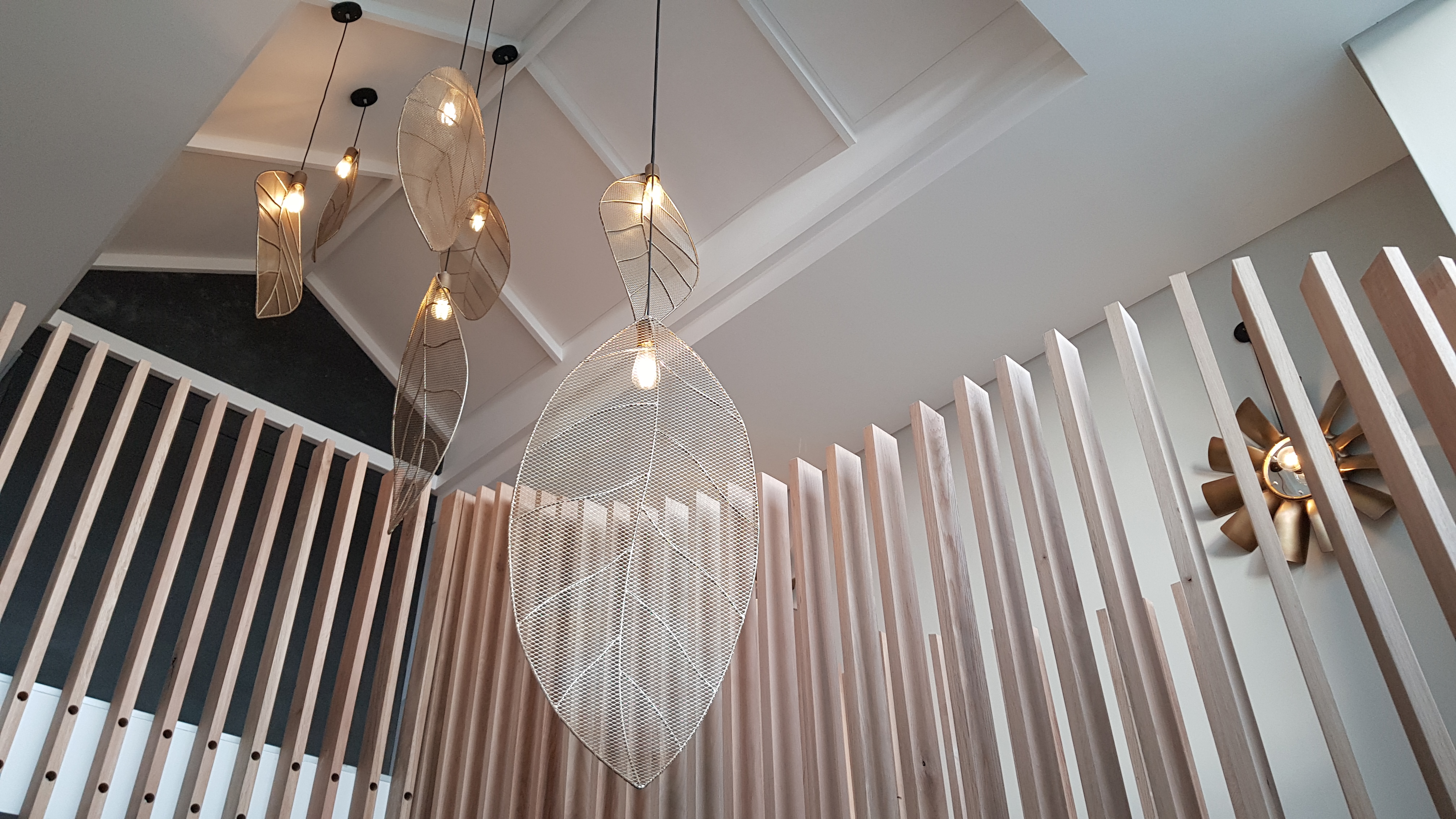 Multiple Silver leaf lights in an entrance hall