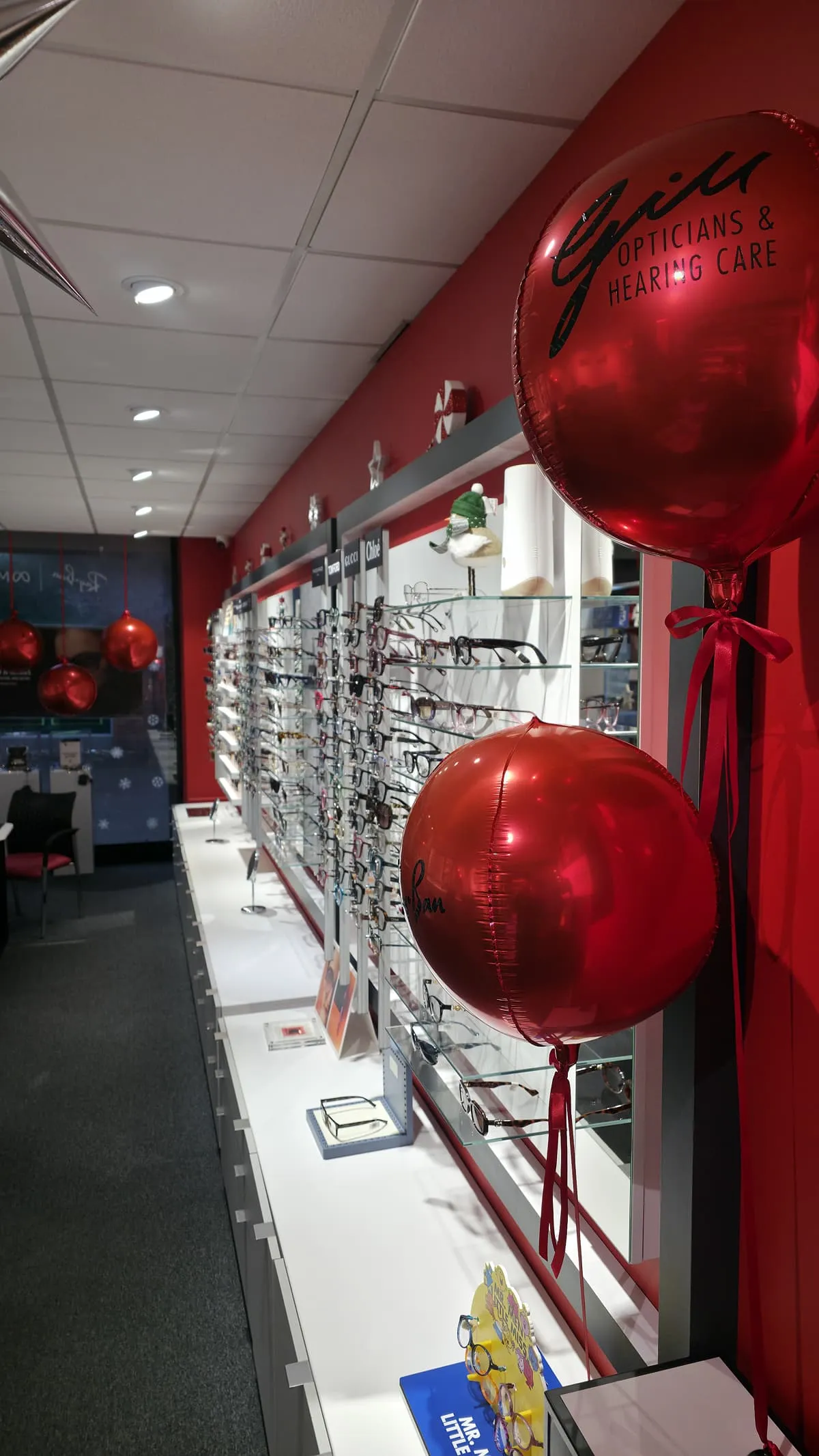 Inside Gill Opticians store with balloons