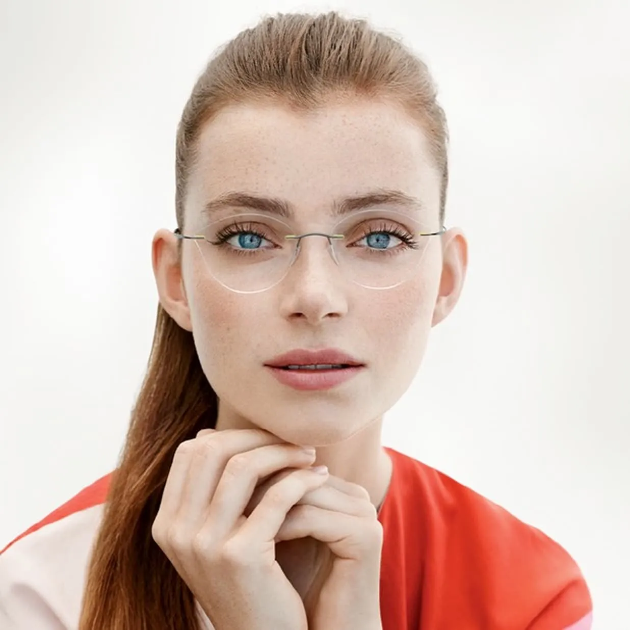 Woman wearing Silhouette designer glasses