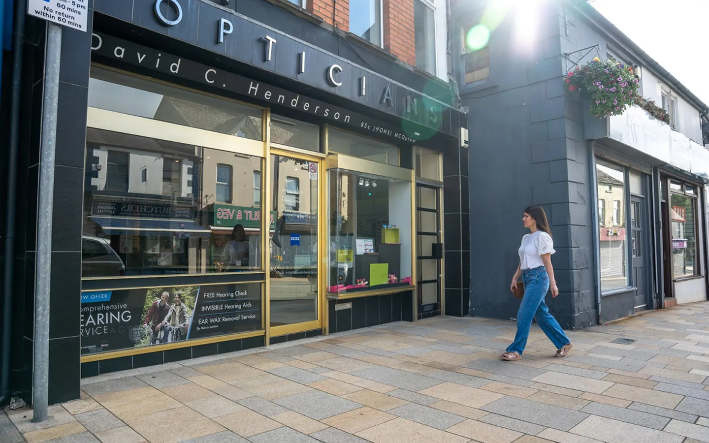 David C. Henderson Opticians storefront on the high street offering eye care and hearing services
