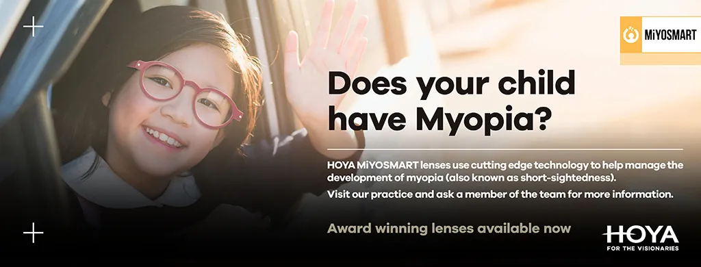 Smiling child wearing red glasses waving, with text about MiYOSMART lenses to manage myopia in children.