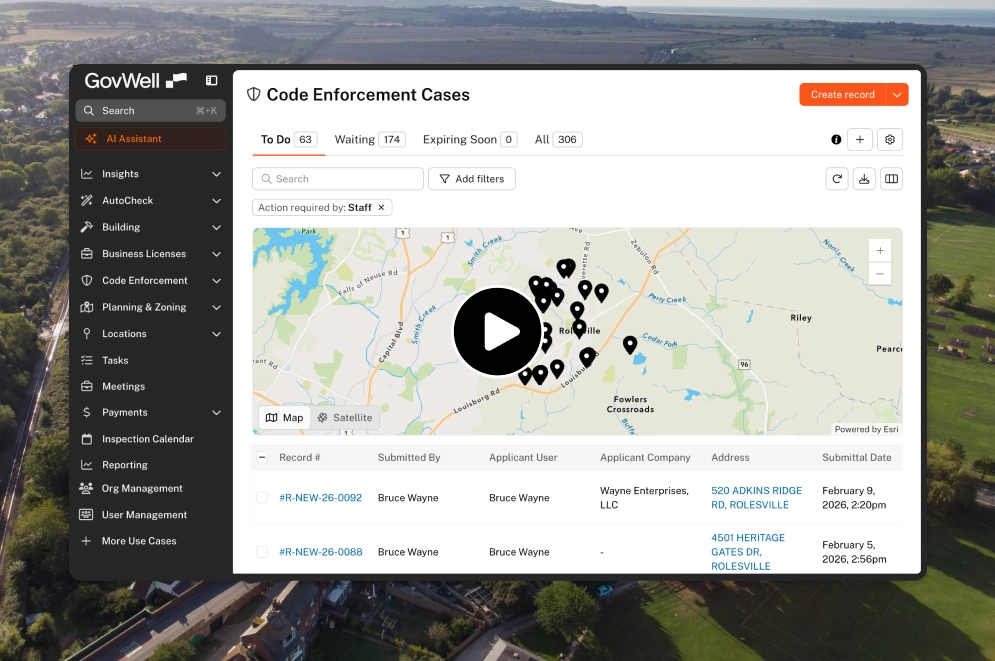 GovWell dashboard showing building permits with a map highlighting locations and a table listing permit records submitted by Bruce Wayne.