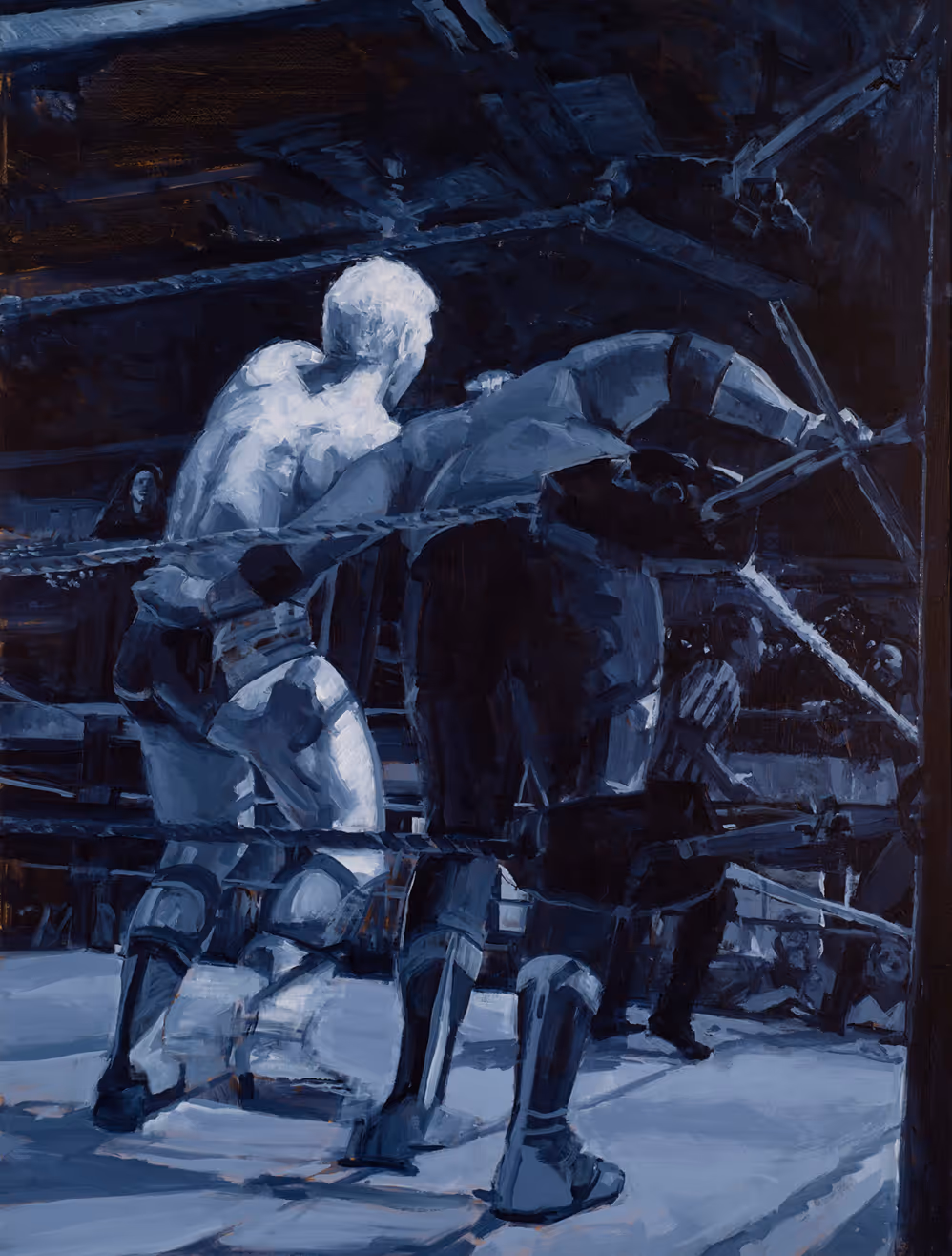 Two wrestlers in a ring, one lifting the other near the ropes in a dark arena.