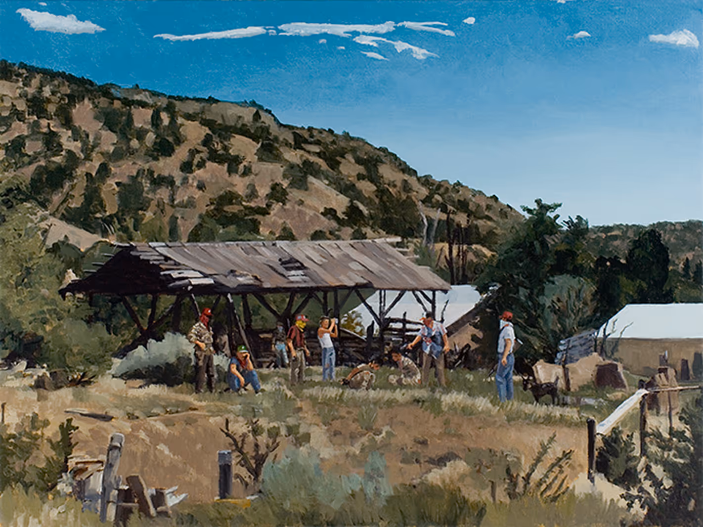 People gathered near a rustic wooden shed in a dry, grassy hillside landscape with hills and blue sky.