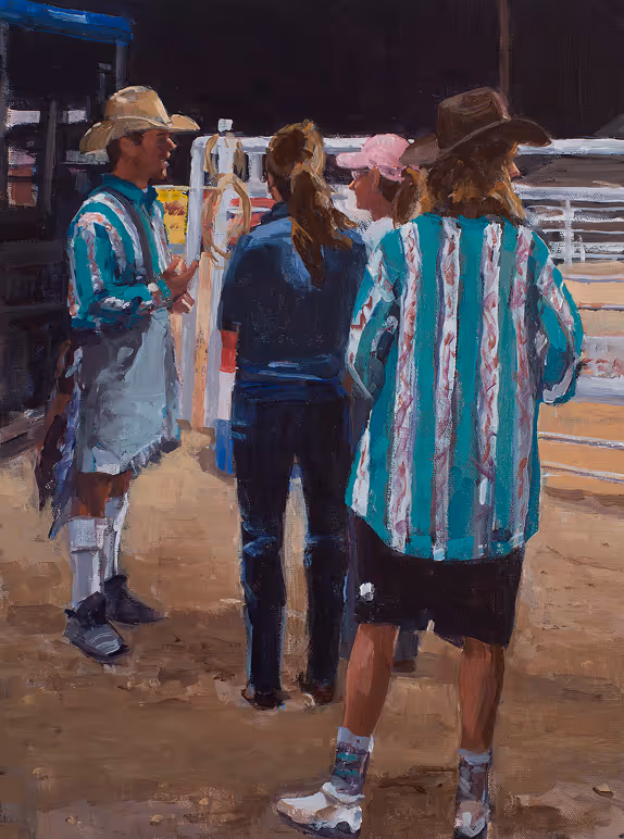 Four people standing on dirt ground, two wear striped shirts and cowboy hats, outdoors near fence.