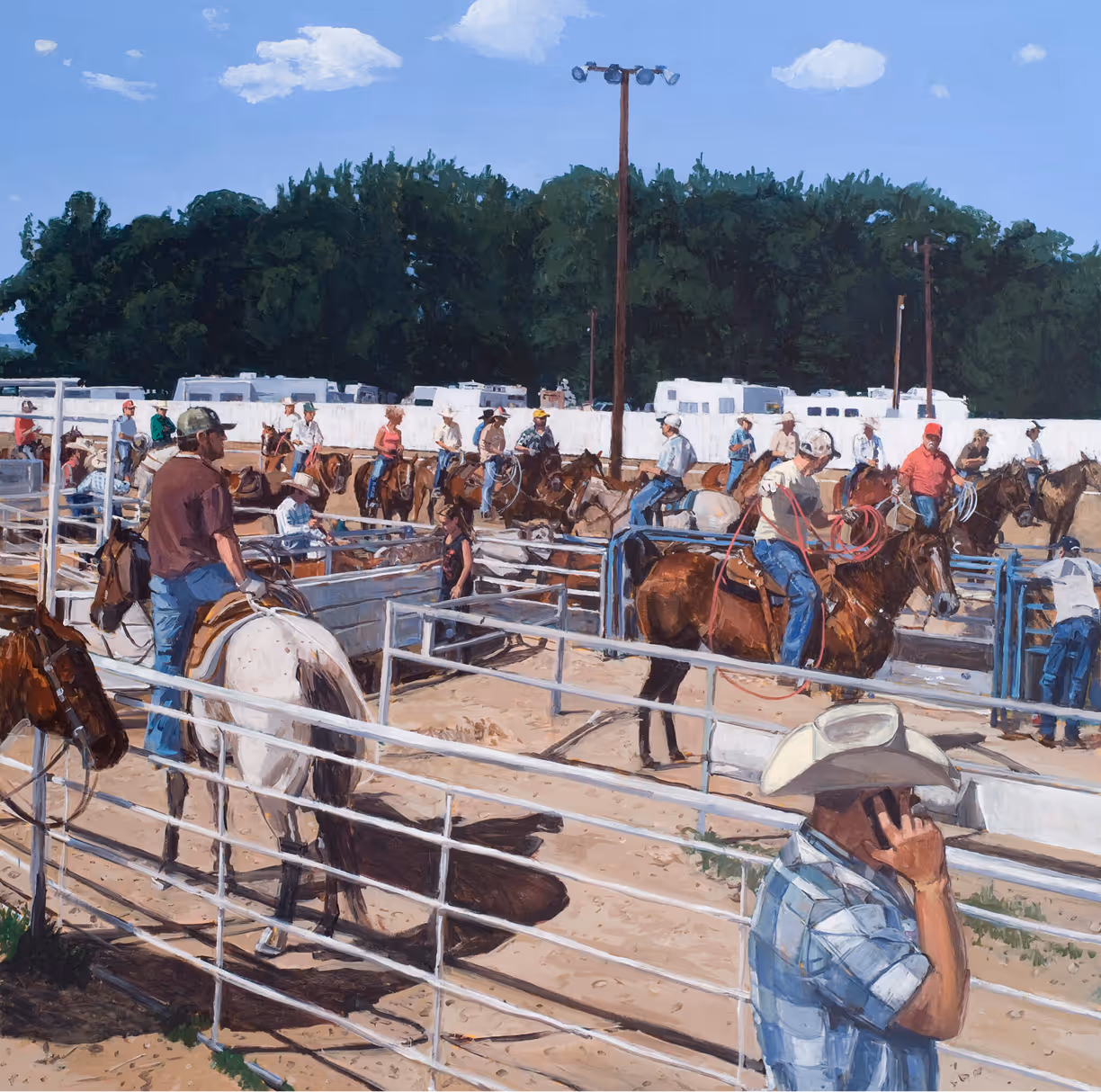 Cowboys on horseback preparing inside ranch pens under clear sky with trees and RVs in background.