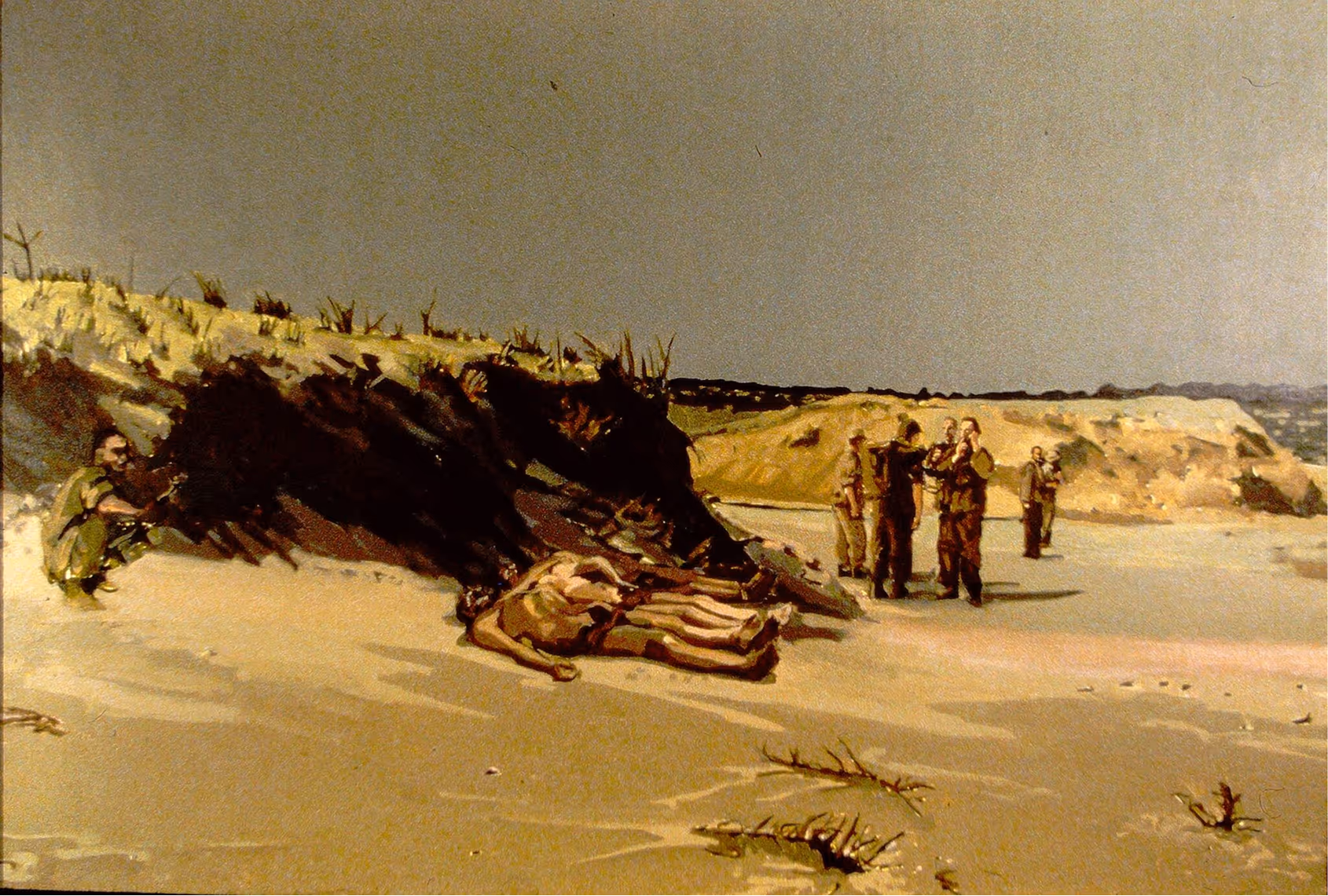 Seven soldiers in desert scene: five standing, one crouched, and one lying on sand near a dark trench.