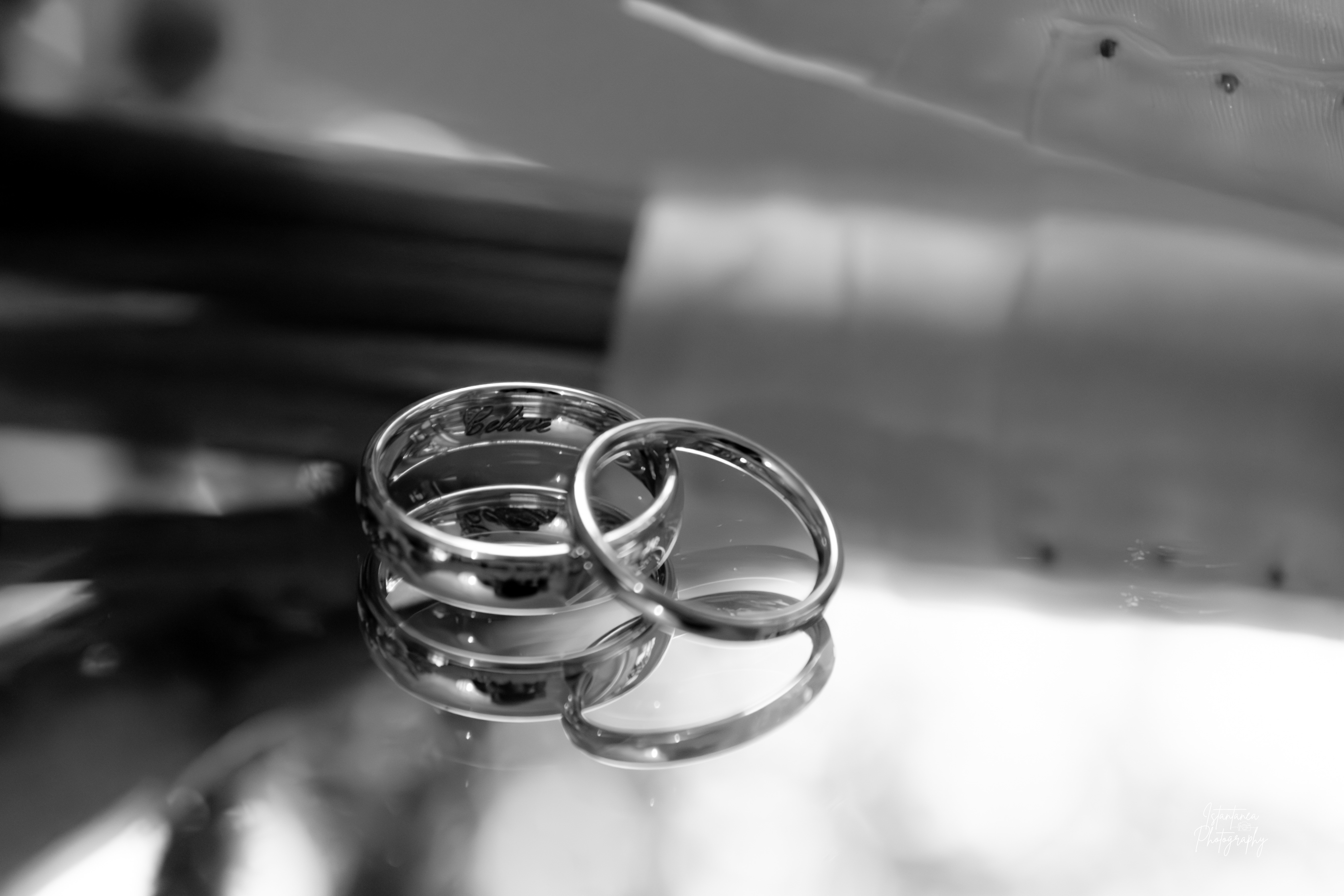 image featuring multiple rings with rich, intricate designs within an ornate display case of a sophisticated jewelry store.
