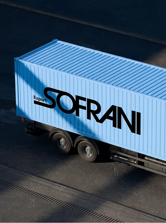 Light blue cargo container trailer with the black text 'Export SOFRANI' on its side, parked on an asphalt surface.