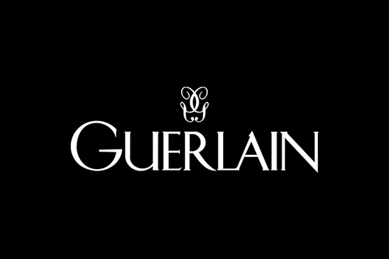 Guerlain brand logo with stylized double G emblem above the company name in white on black background.