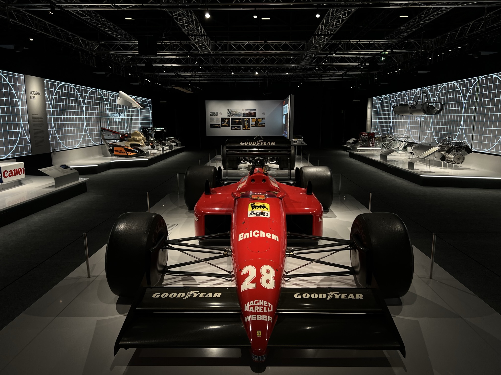 A historic Formula One car professionally lit on display at the F1 Exhibition, Madrid