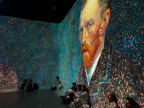 A large-scale projection of Van Gogh's artwork displayed on walls and floor at Frameless, London