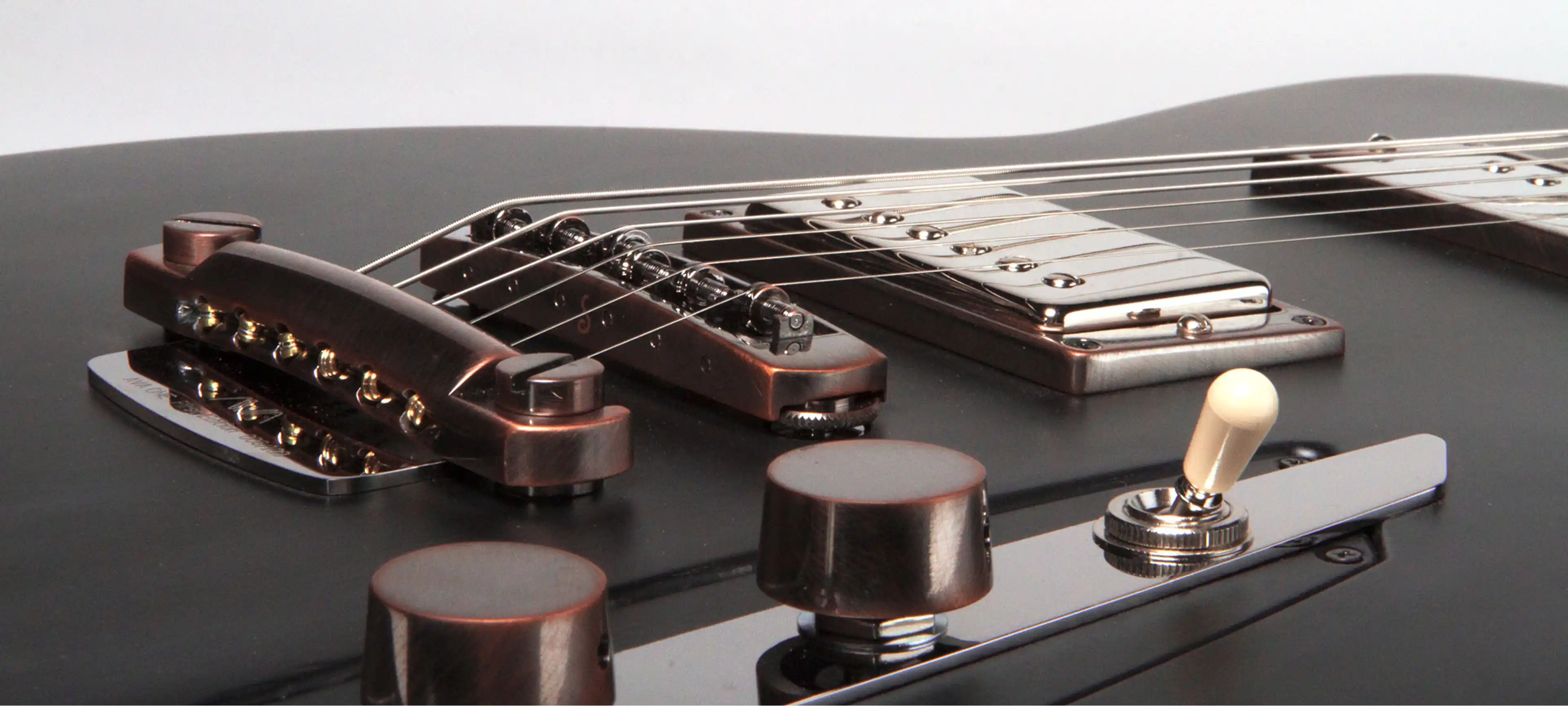 Fotografia de um detalhe da guitarra.