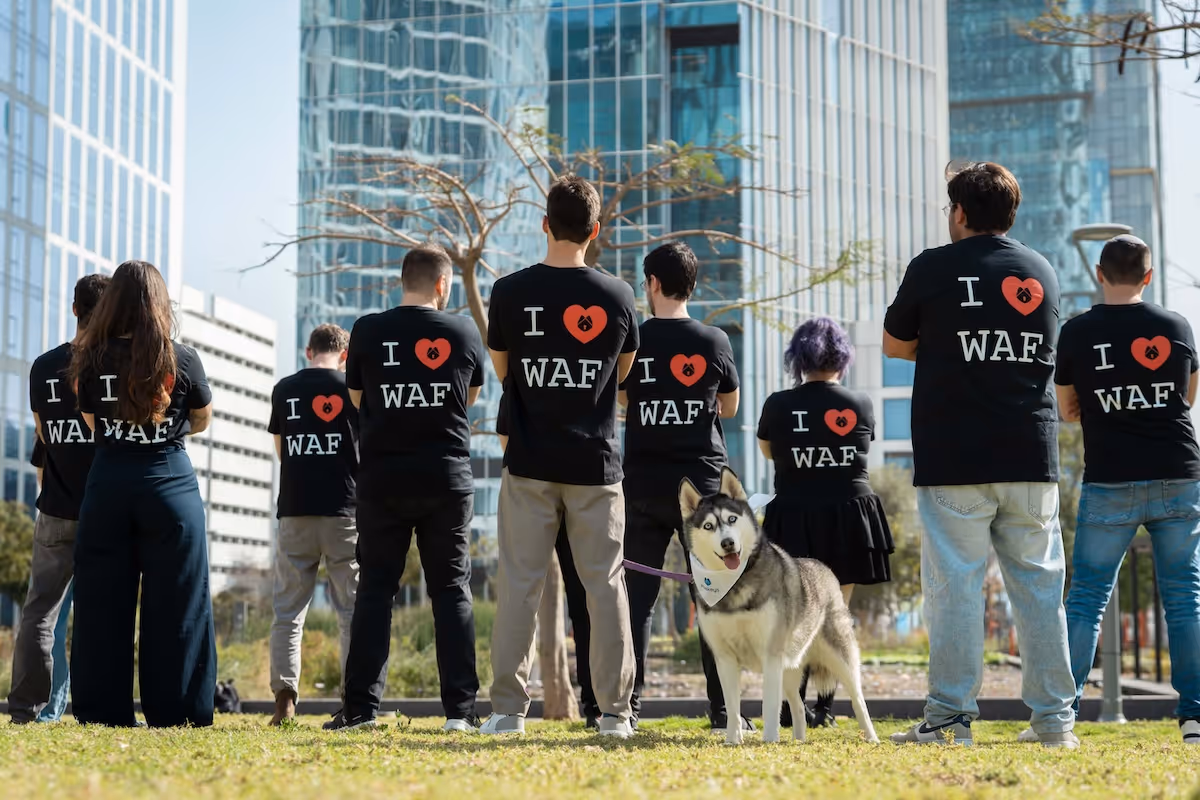 Huskeys team with their backs showing their I love WAF t-shirts