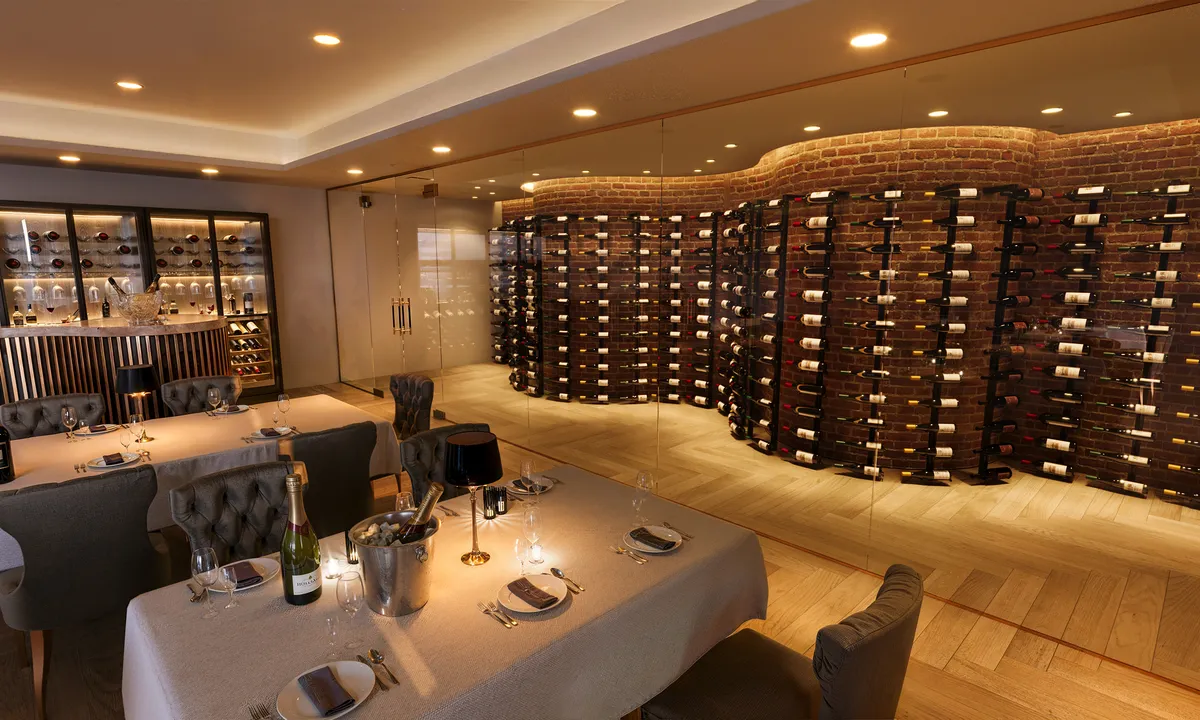 Commercial wine cellar in a restaurant private dining room, with curved floor-to-ceiling bottle racking