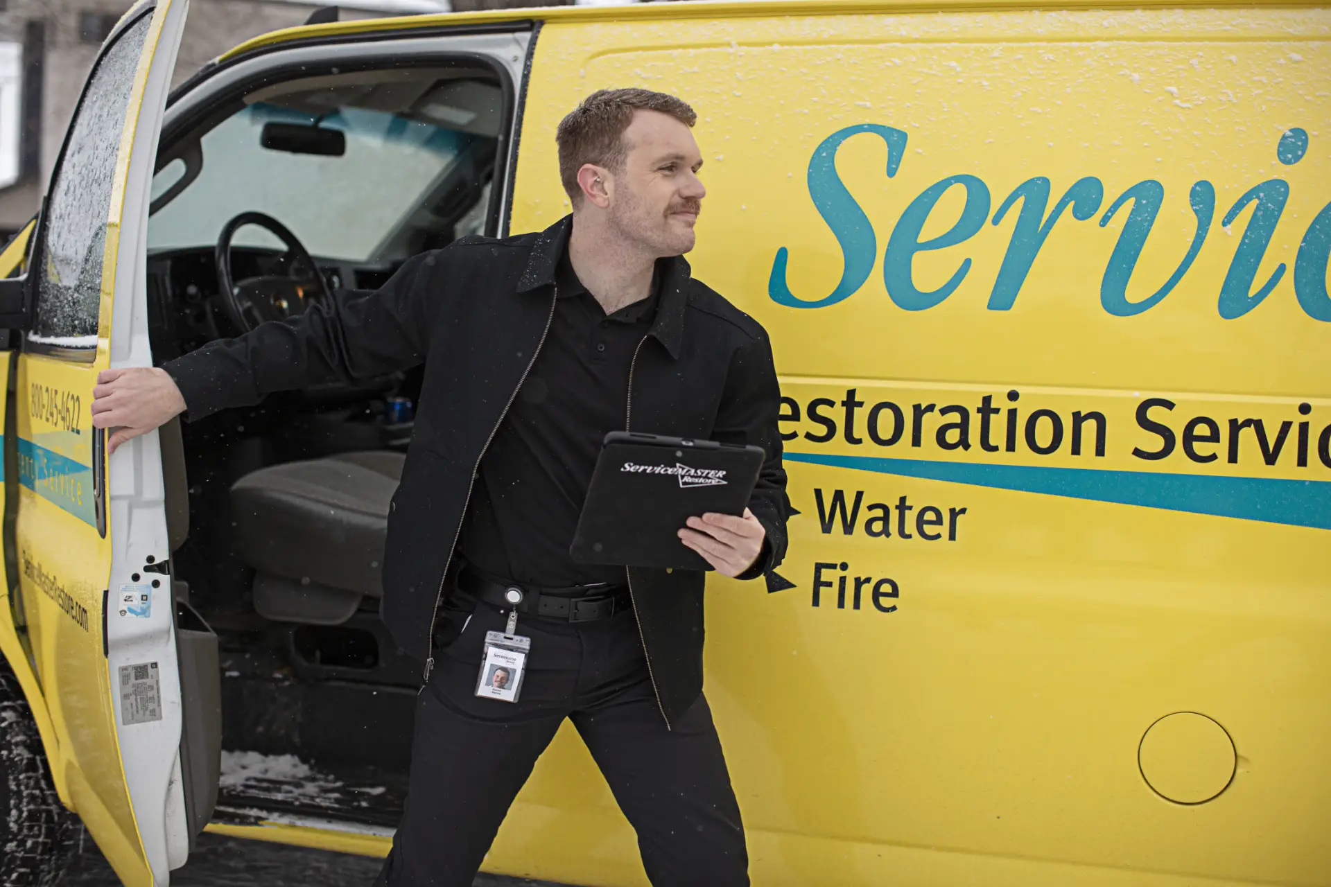 ServiceMaster technician arriving on site in the winter to provide restoration services.