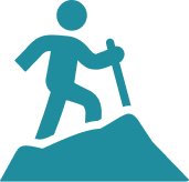 Icon of a person hiking with a walking stick on a hill.