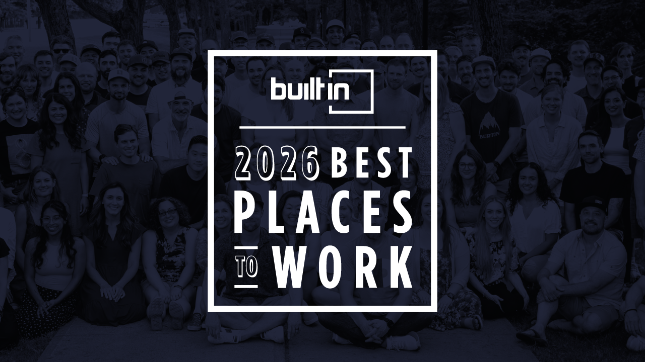 Group of people posing behind text reading '2026 Best Places to Work' with Built In logo.