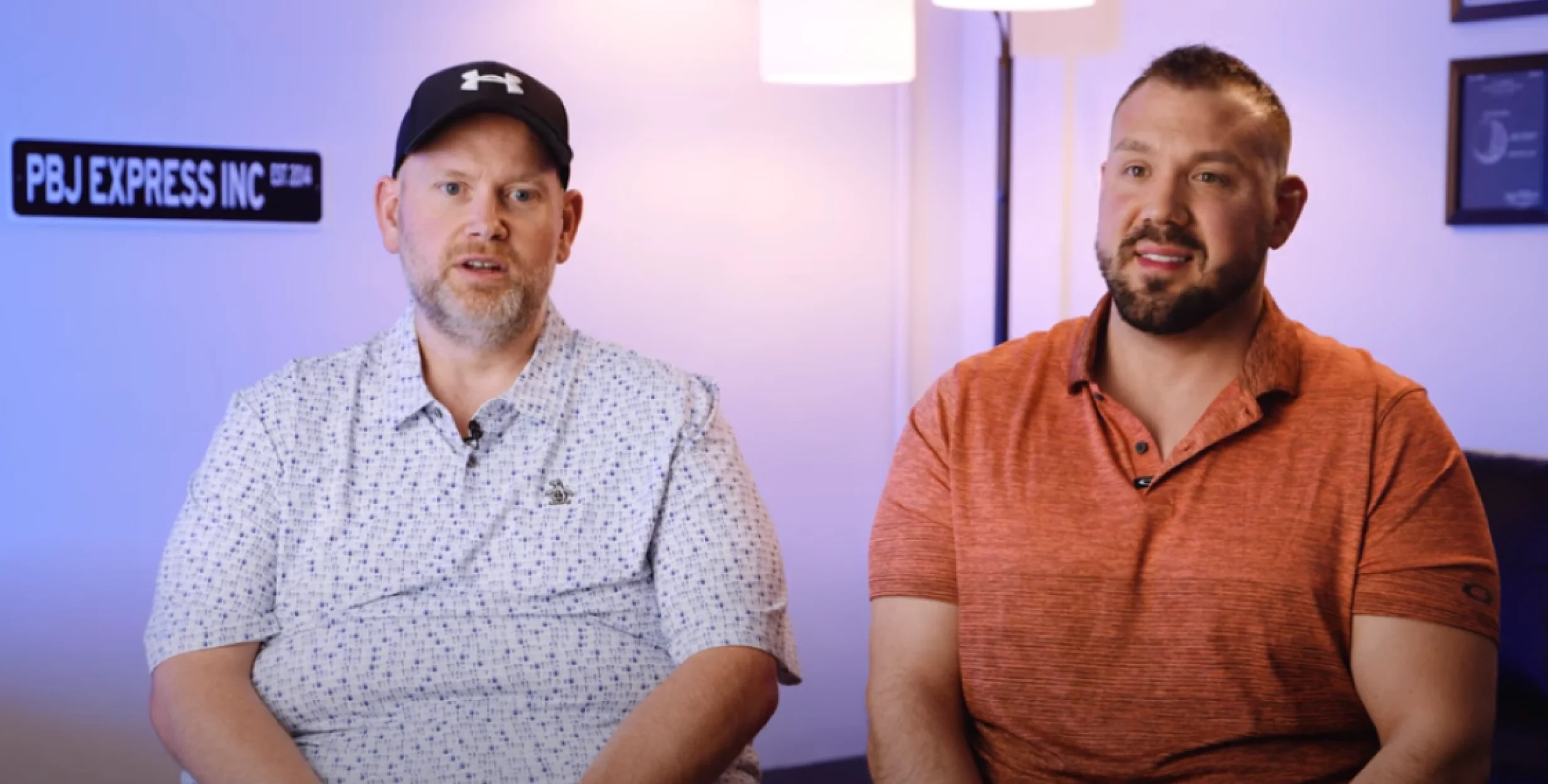 two men being interviewed
