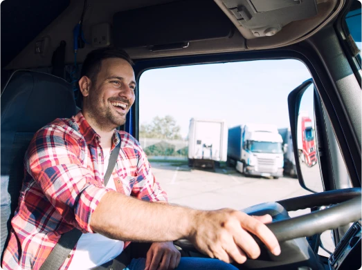 man driving truck smiling