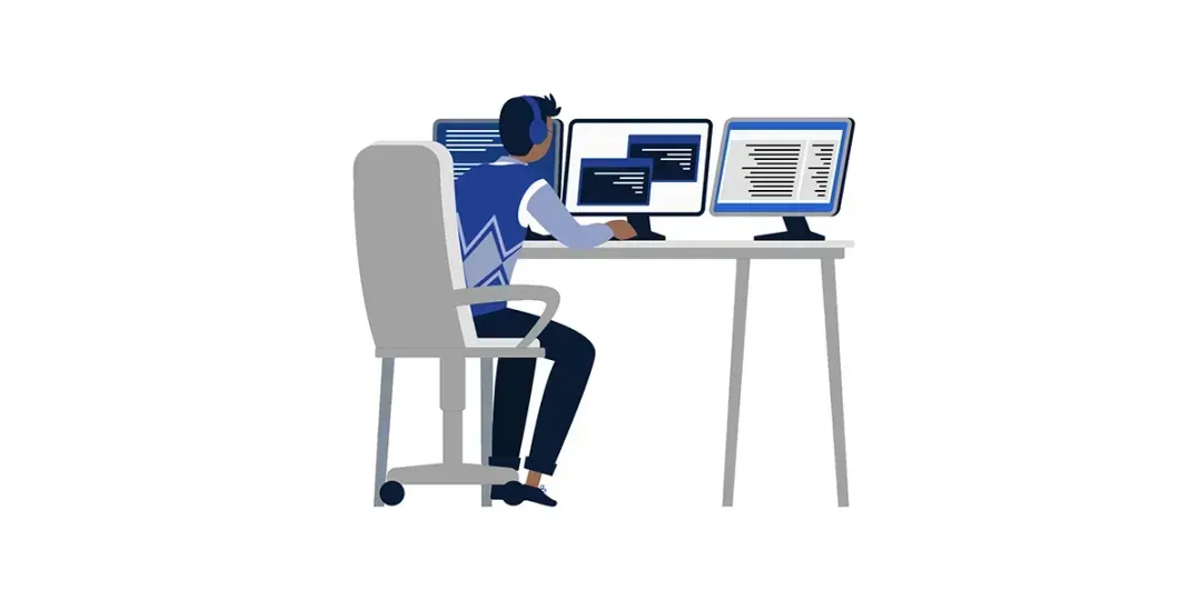 person-sitting-at-computer-desk-with-3-monitors