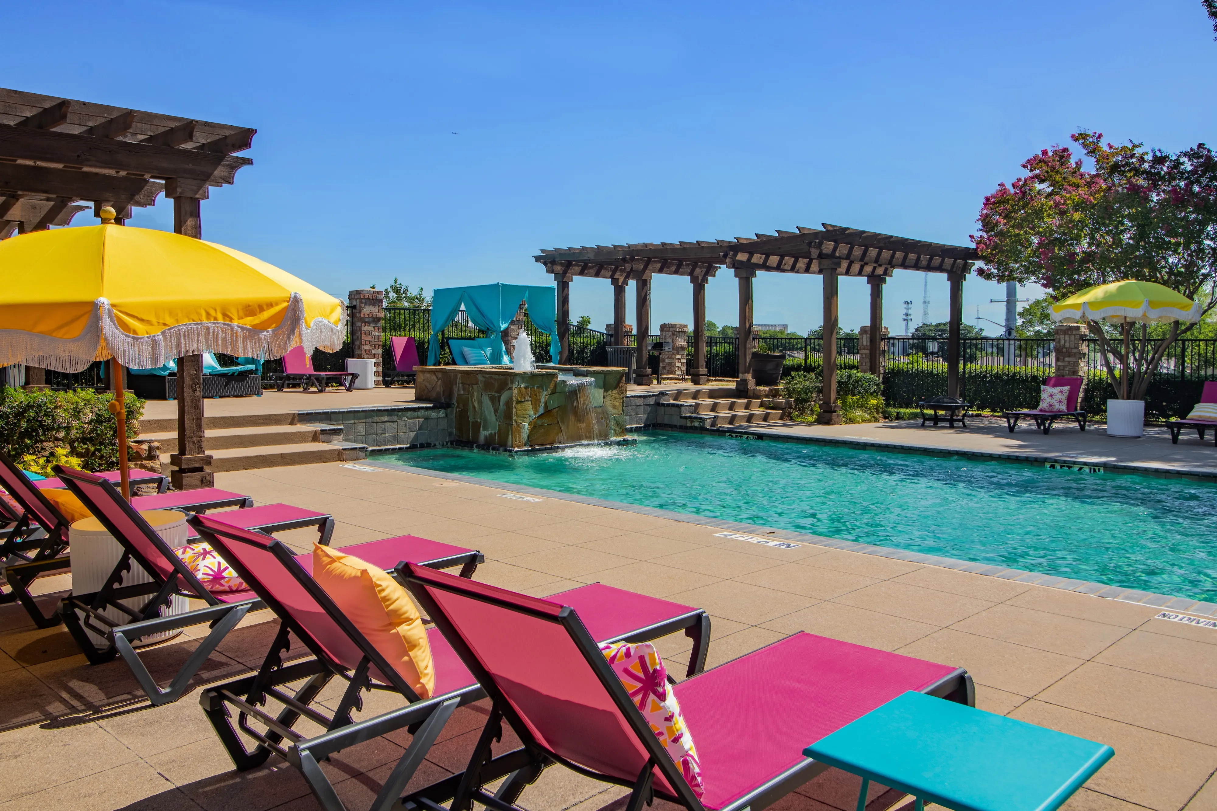 Pool with pink lounge chairs