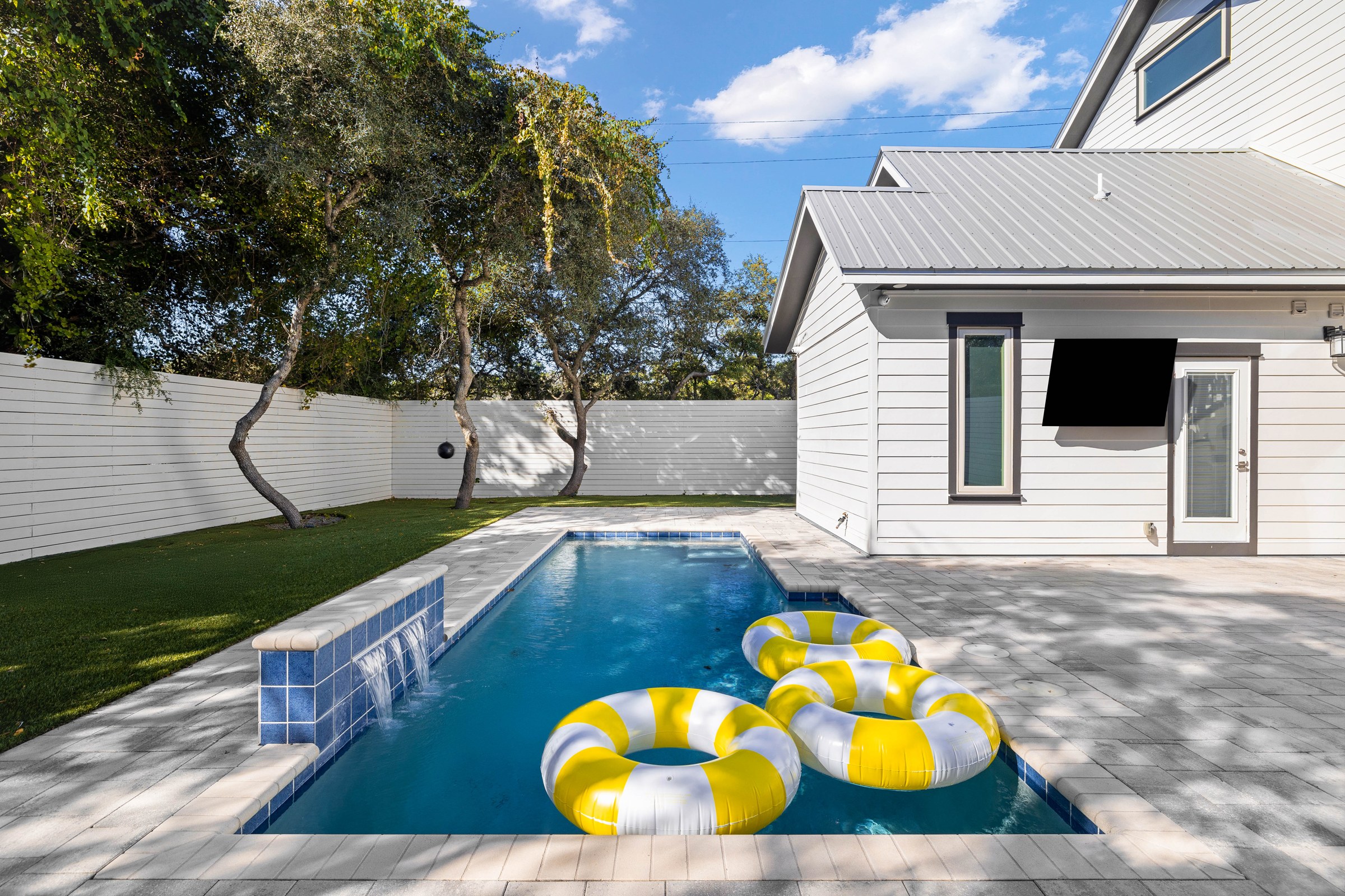 Clear Emerald Coast backyard pool between second-home visits