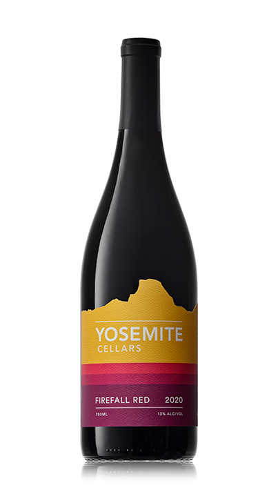 Bottle of Yosemite Cellars Firefall Red 2020 wine with a label featuring a gold mountain silhouette and red and purple stripes.