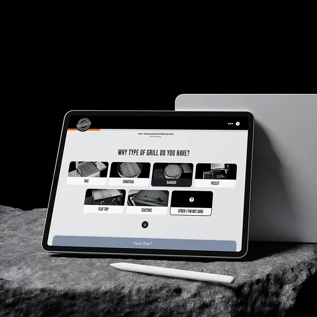 GrillGrate product discovery tool on a tablet on stone