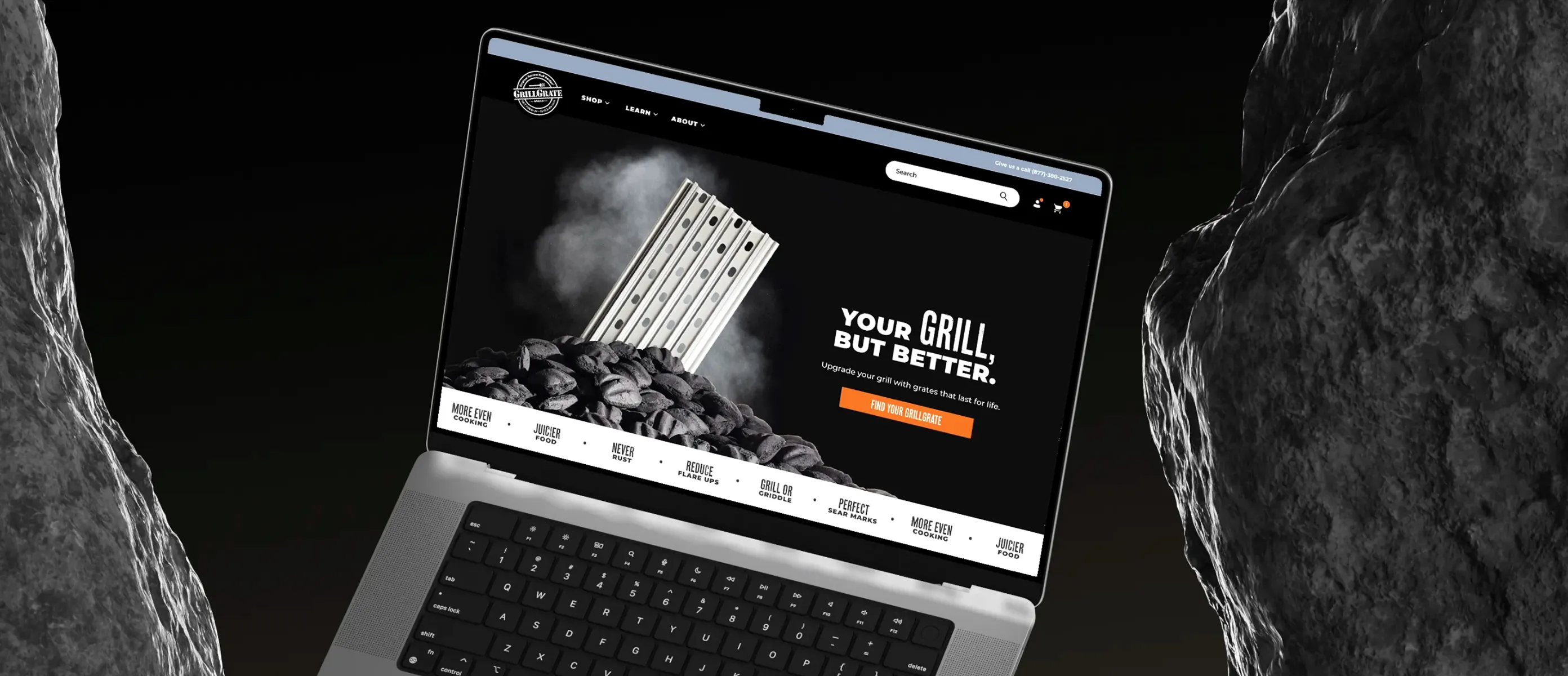 GrillGrate website on an open laptop floating between two stones