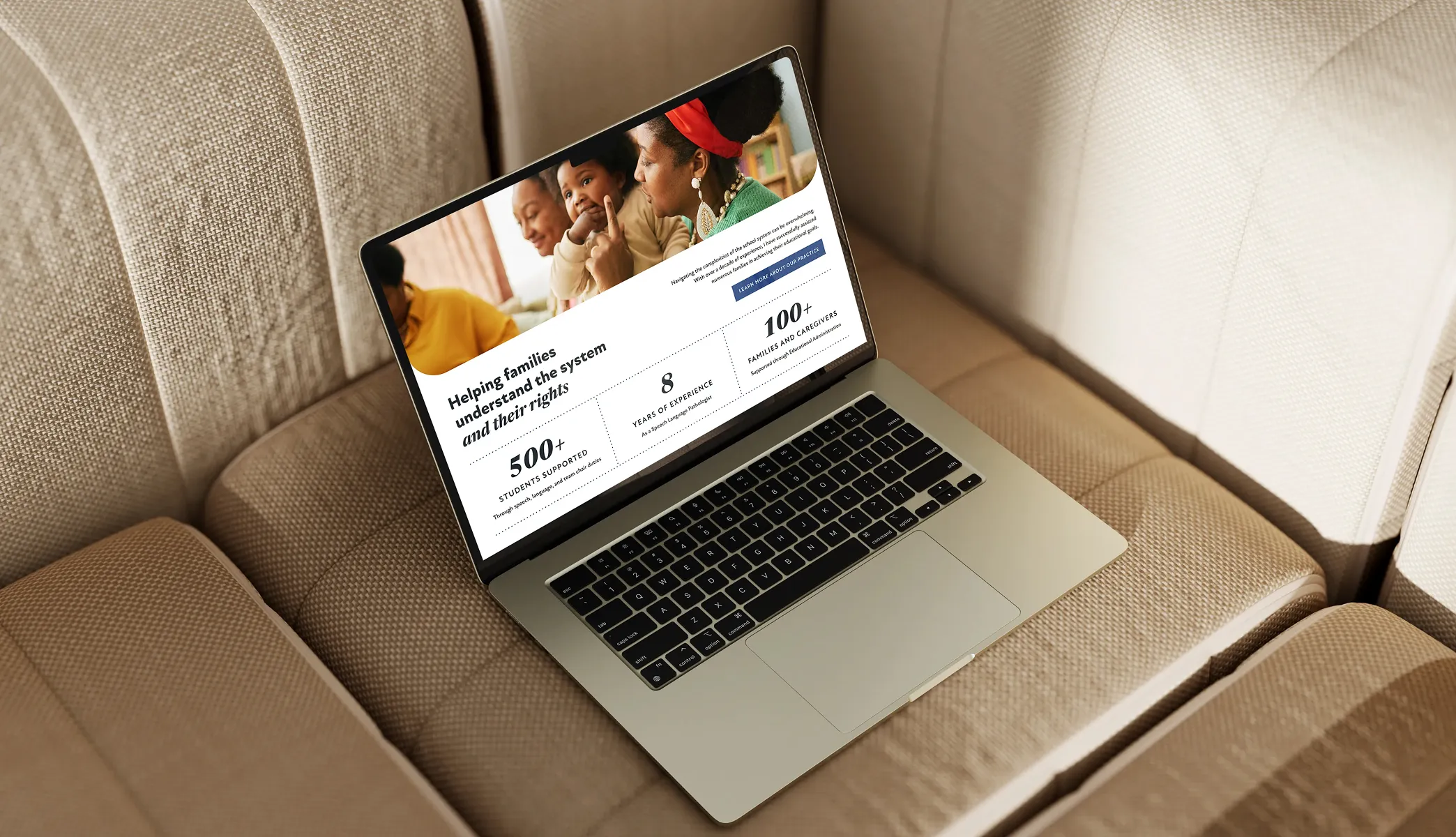 Laptop on couch showing Speech Language Nook's website