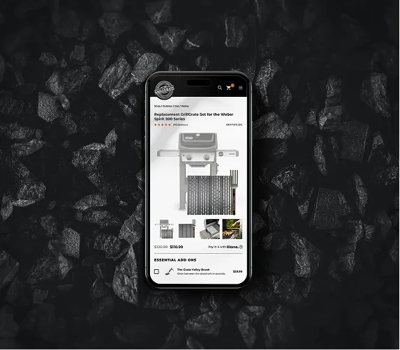 Smartphone on charcoal background displaying a replacement grill grate set for Weber Spirit 200 Series on a shopping site.