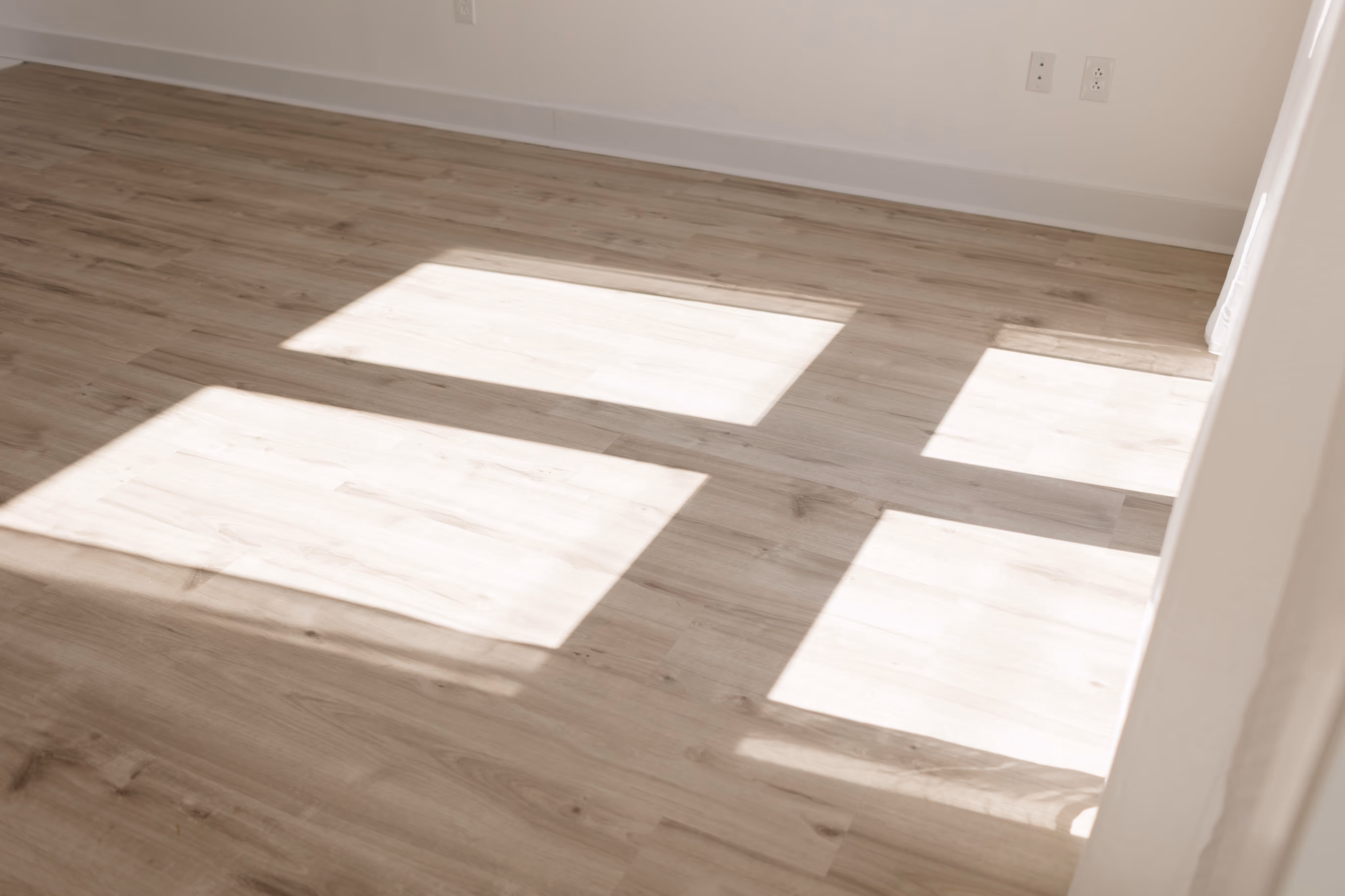 Shadows bouncing on the hardwood floors inside of Brightroom Studio