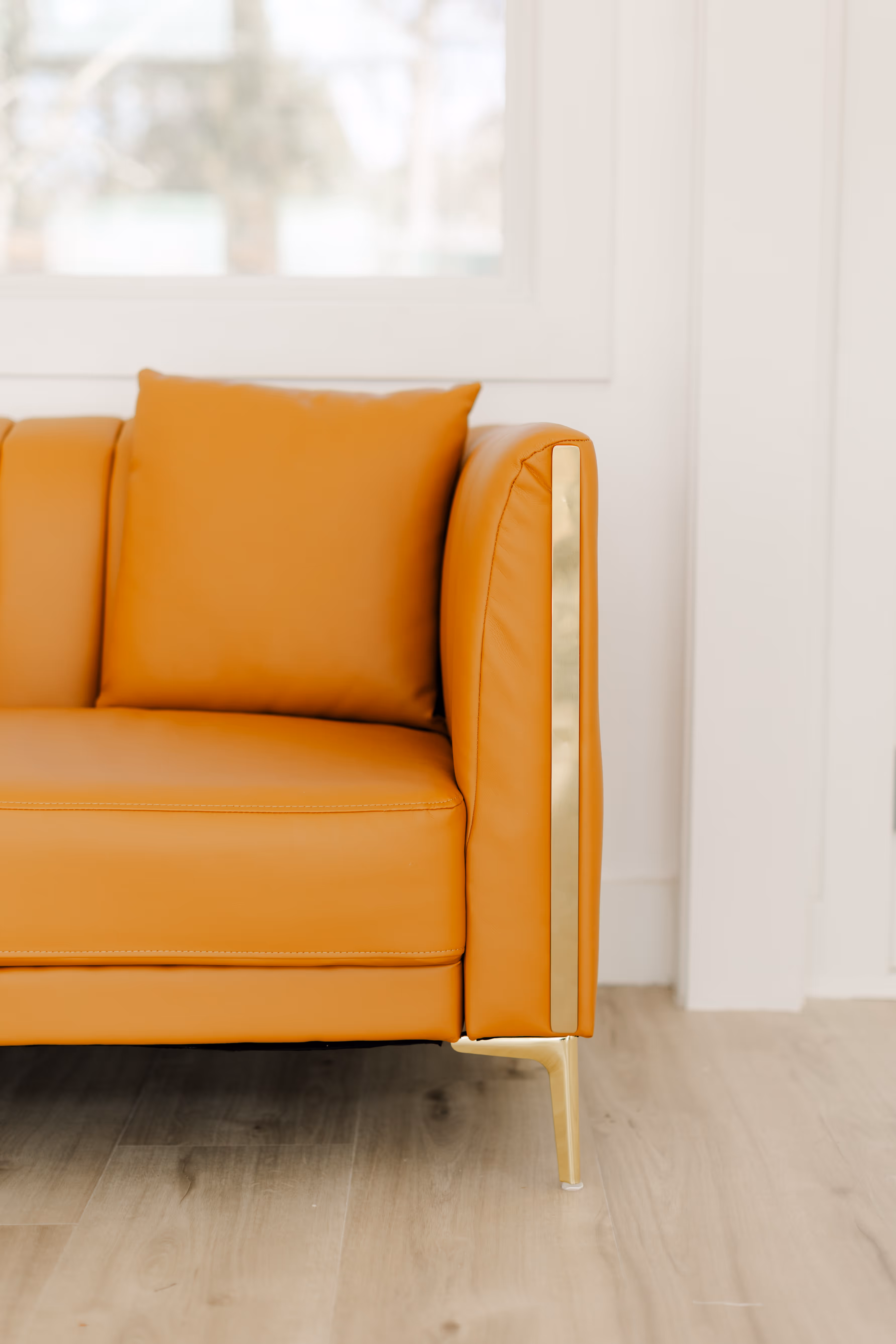 A modern couch for display and use at Brightroom Studio