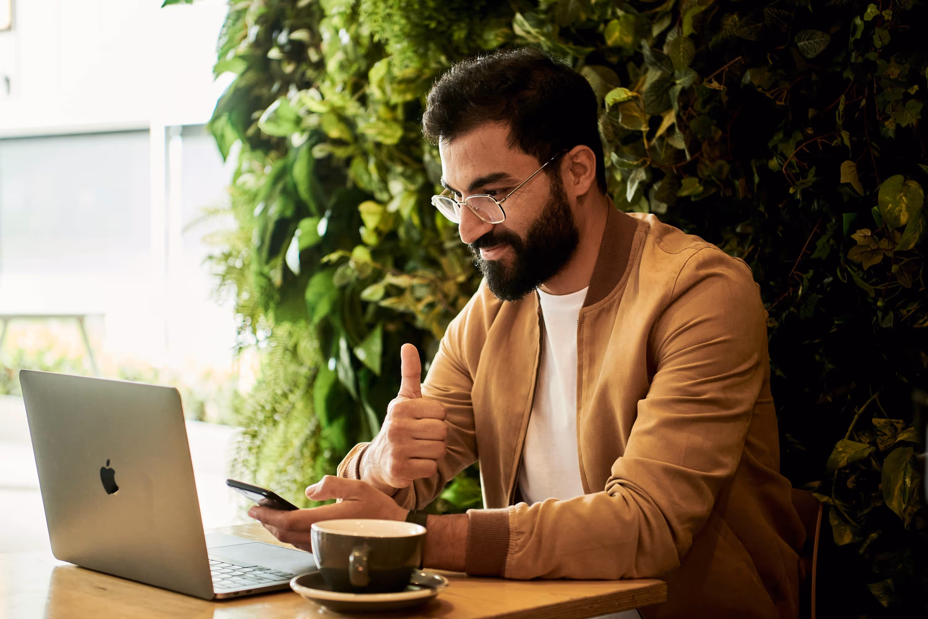 Man Sitting Behind A Laptop